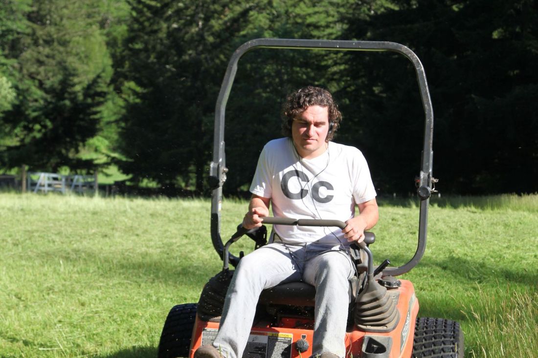 One of our crew on the ride-on mower